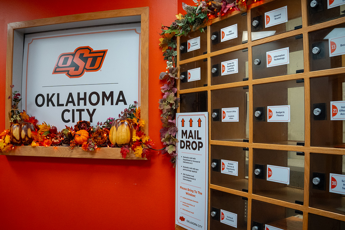 Several inter-office mail boxes listing department names.