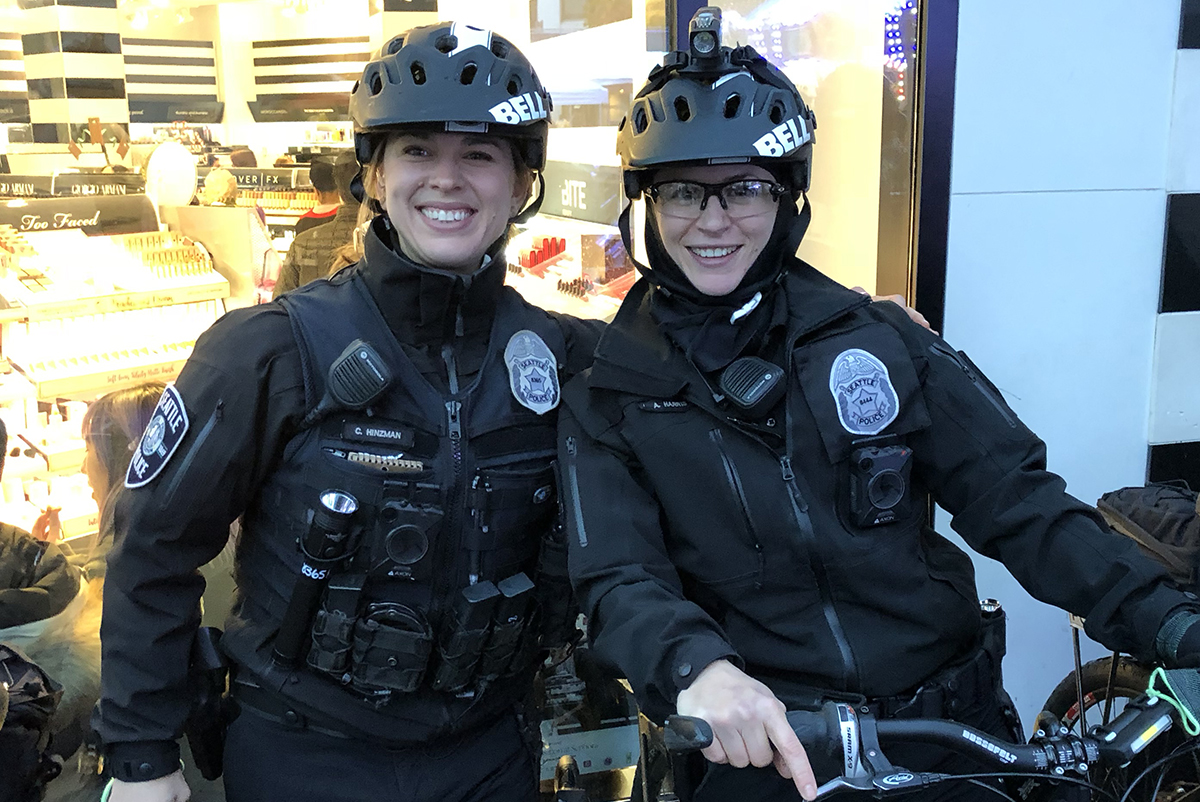 Police women with bicycles