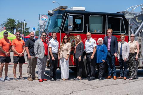 Officials from Warr Acres and OSU-OKC stand in front of a fire truck being donated to OSU-OKC by the City of Warr Acres. 