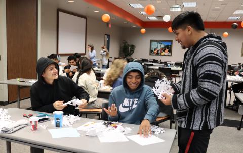 OSU-OKC Upward Bound Students craft paper snowflakes to decorate Bethany Children's Health Center