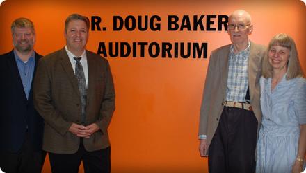 Liberal Arts Division Head Jason Stone, Academic Affairs Vice President Joey Fronheiser, Dr. Doug Baker and his wife, Linda, stand at the entrance of the newly renamed Dr. Doug Baker Auditorium. 